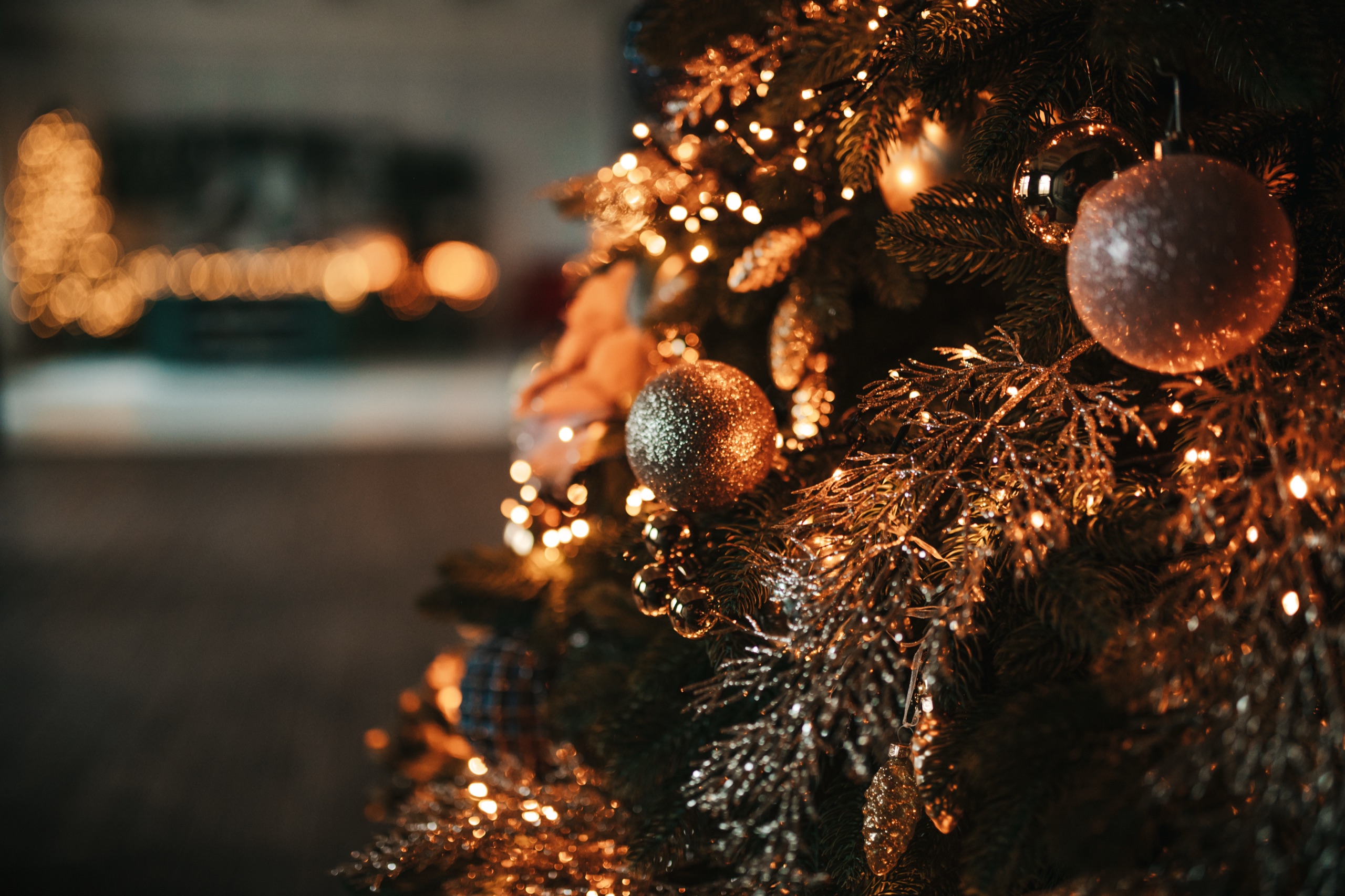 Black and gold Christmas tree after dark