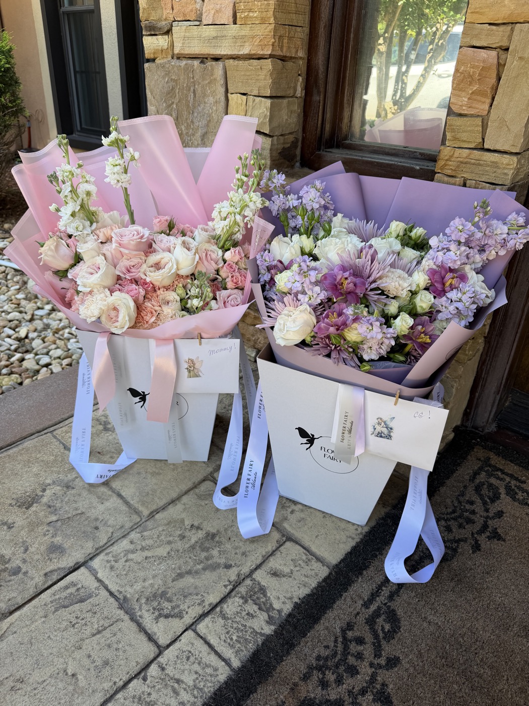 Blush and lavender holiday bouquets wrapped by Flower Fairy